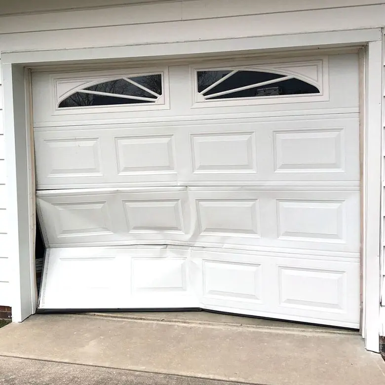 dented garage door panel